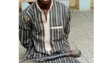 A Man Is Seen Smiling After Being Arrested For Murdering His Parents With A Pestle in Jigawa