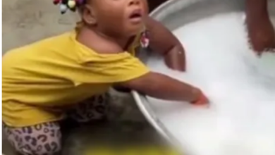 Cute little girl falls asleep while assisting mum to wash (Video)